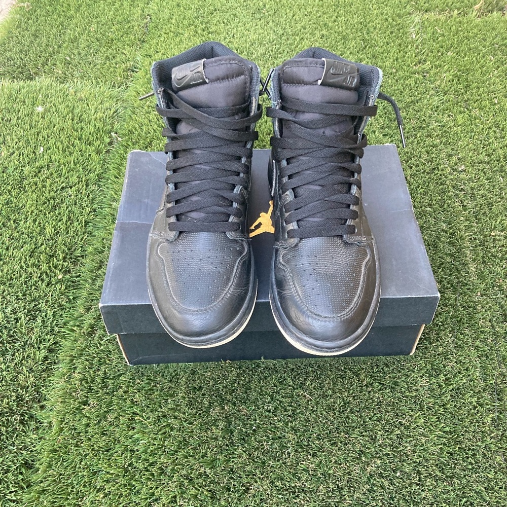 Black perforated Jordan 1’s